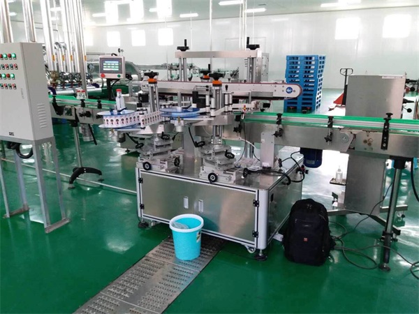 河南-飲品雙側(cè)面貼標(biāo)機(jī)使用現(xiàn)場